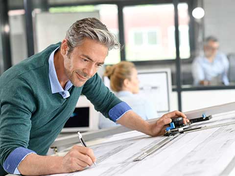 man creating the schematics for a Commercial HEPA Filters in Reston