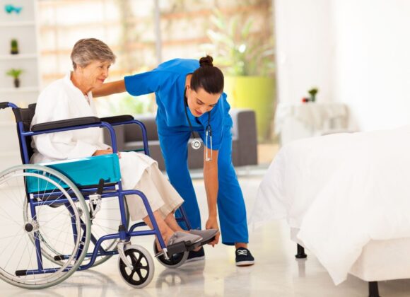Caregiver taking care of a woman in wheelchair in a Healthcare Facility with HVAC Services in Washington DC, Alexandria, Arlington VA, Baltimore, Bethesda MD